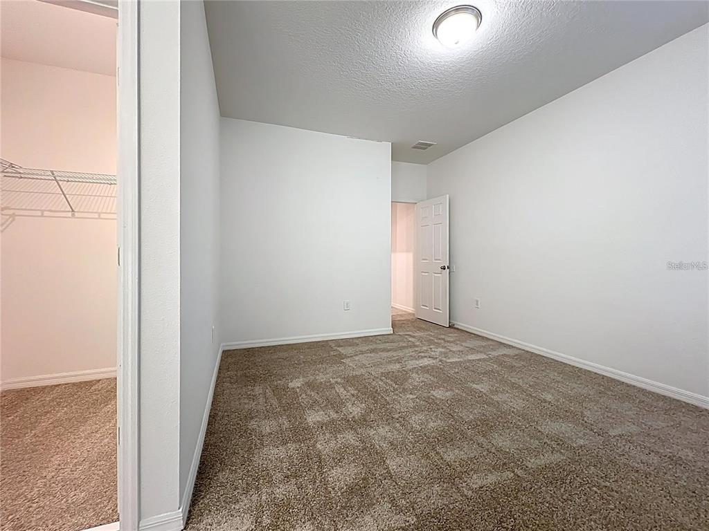 12821 Westside Vlg Loop Windermere, FL 34786 - Photo 33 of 42 an empty room with an entryway