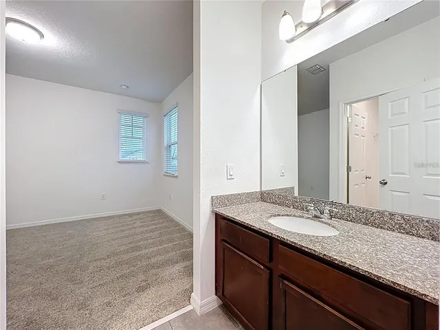 a view of cabinets and wooden floor