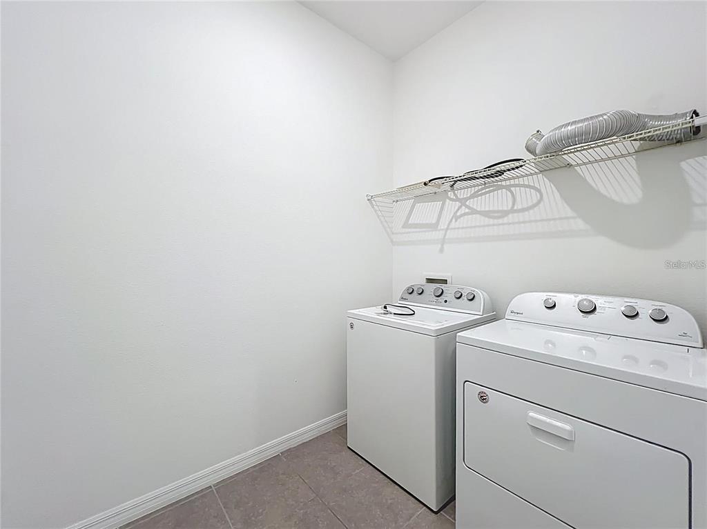 12821 Westside Vlg Loop Windermere, FL 34786 - Photo 39 of 42 a utility room with dryer and washer