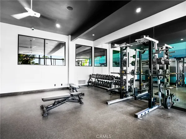 a room with gym equipment and a large window