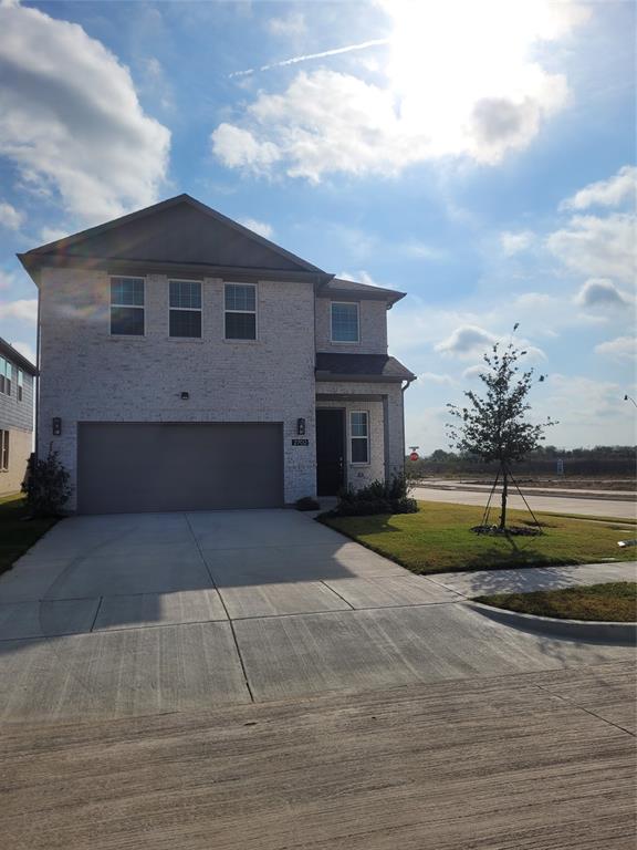 2702 Island Palm Court Forney, TX 75126 - Photo 2 of 15 a front view of a house with a yard
