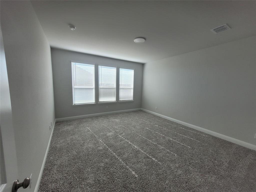 2702 Island Palm Court Forney, TX 75126 - Photo 5 of 15 an empty room with windows