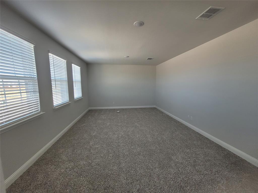 2702 Island Palm Court Forney, TX 75126 - Photo 8 of 15 an empty room with a windows