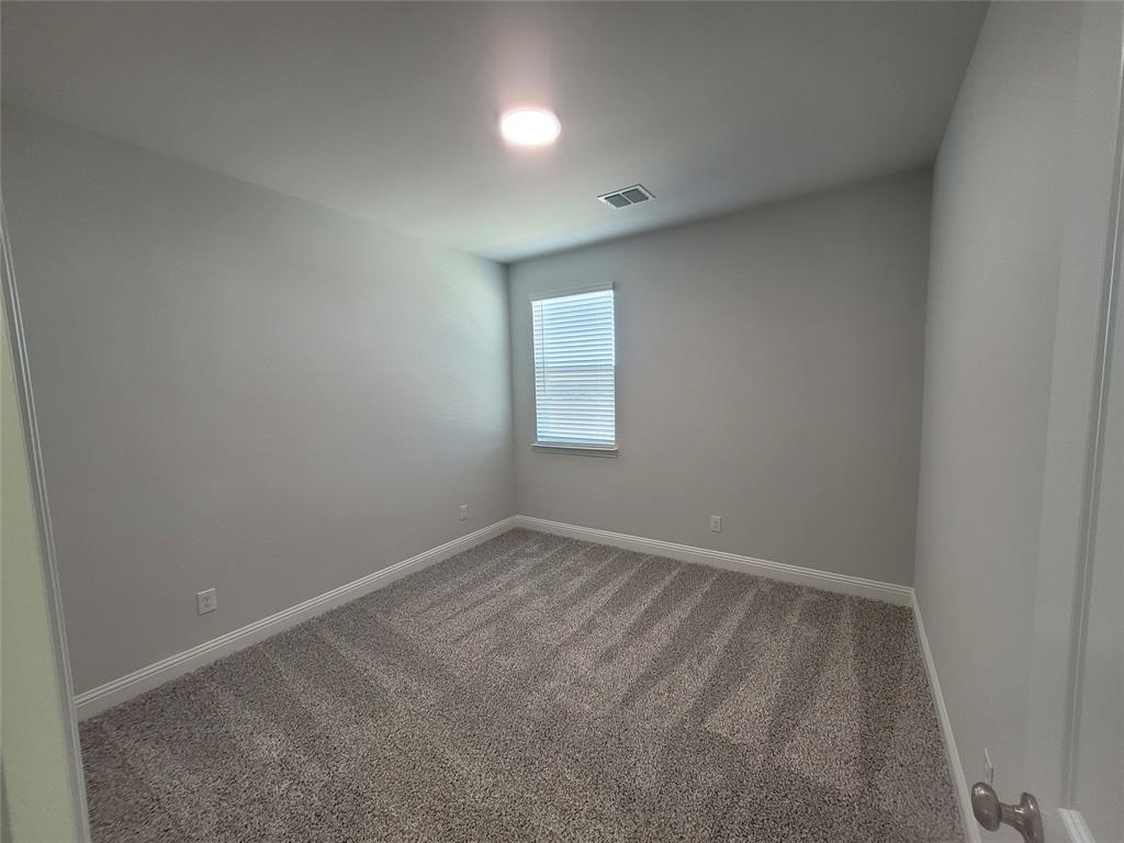 2702 Island Palm Court Forney, TX 75126 - Photo 9 of 15 an empty room with a window