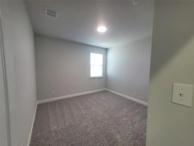 an empty room that has a window