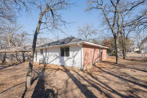 a view of a backyard of the house