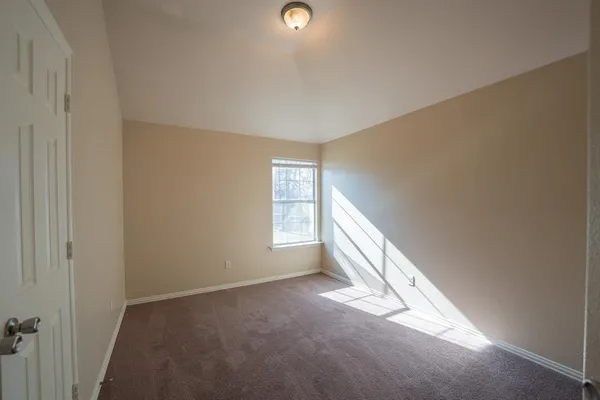 a view of an empty room and window