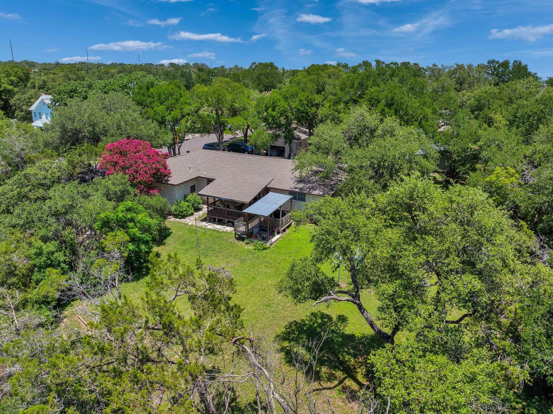 View of subject property with a heavily wooded area