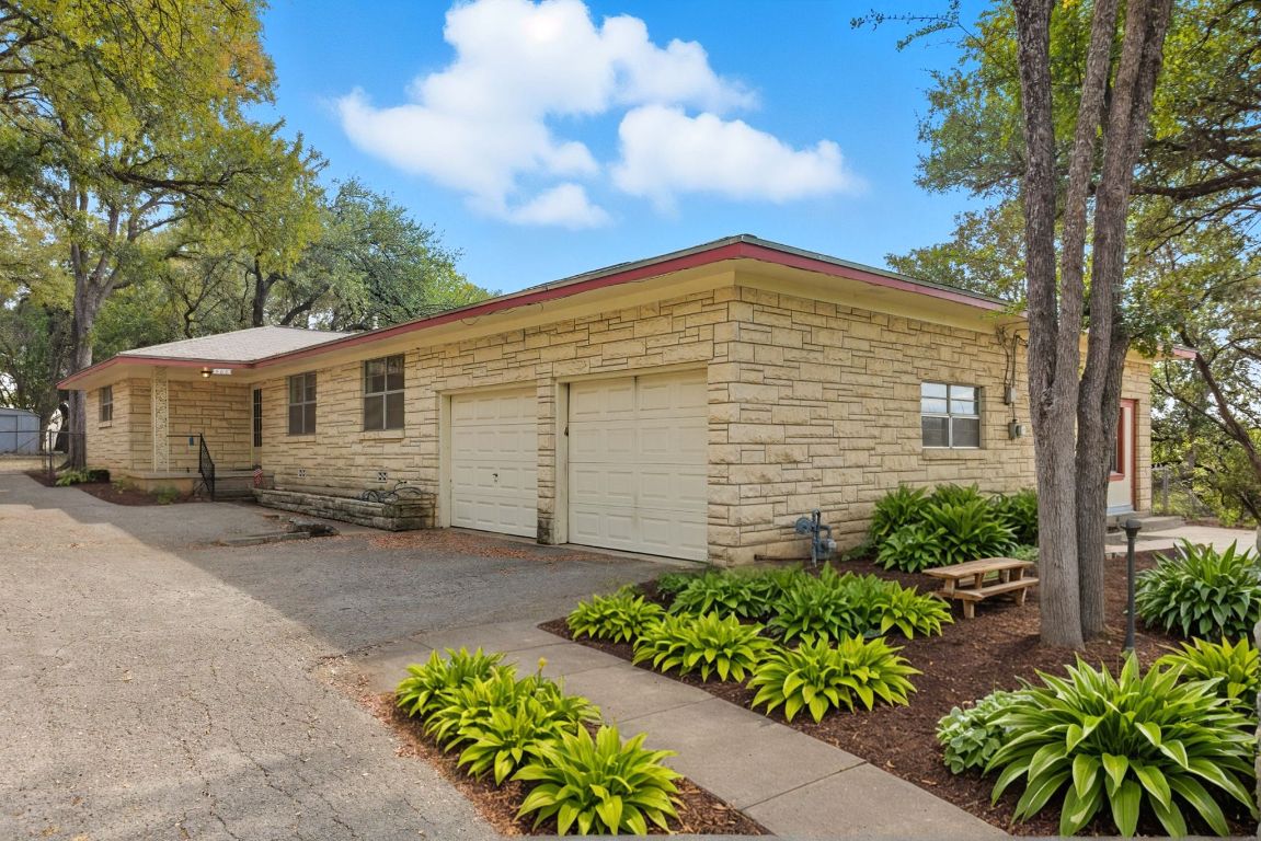 a view of a house with wooden fence