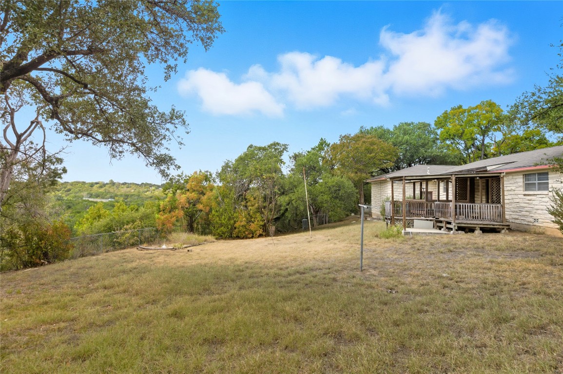 508 Morris Drive Georgetown, TX 78628 - Photo 11 of 40 View of grassy yard featuring a wooden deck