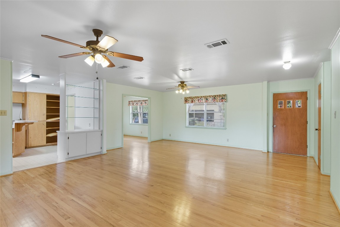 508 Morris Drive Georgetown, TX 78628 - Photo 12 of 40 a view of an empty room with window and wooden floor