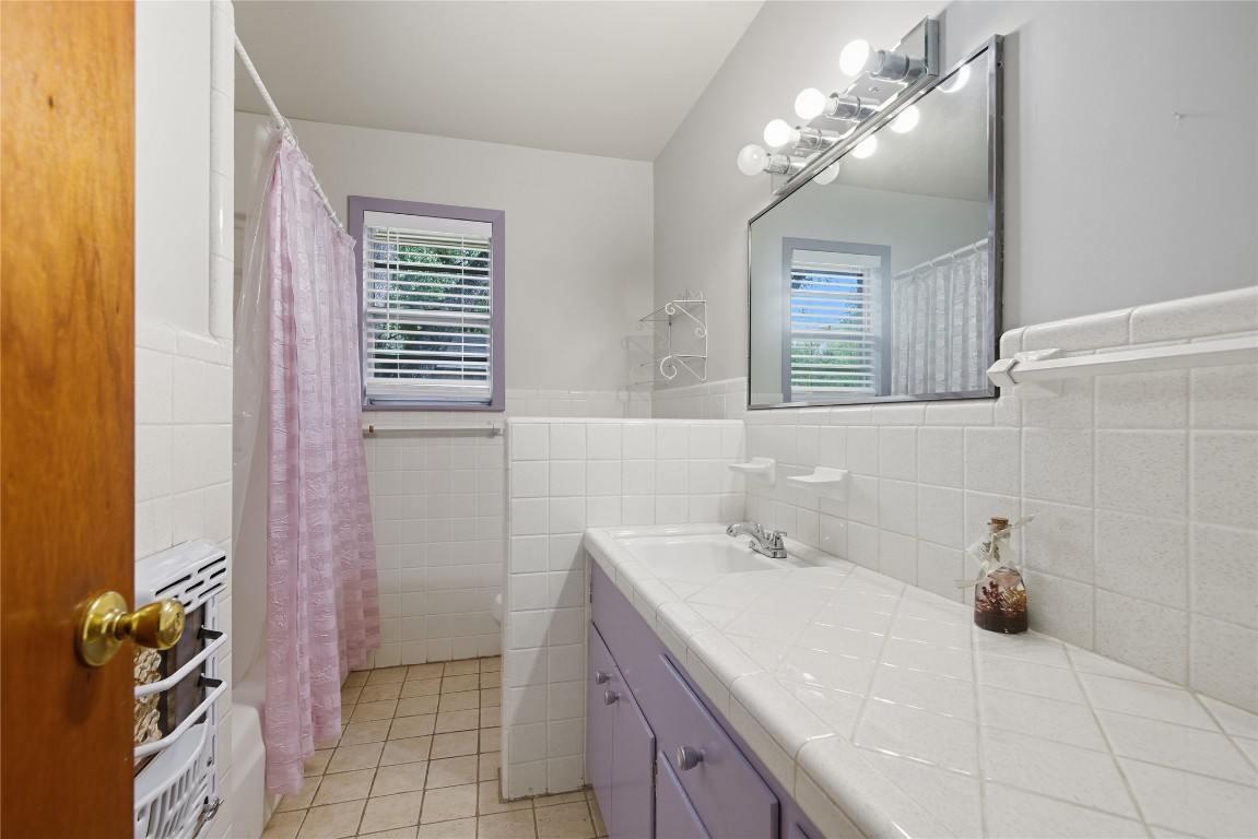 508 Morris Drive Georgetown, TX 78628 - Photo 13 of 40 a bathroom with a sink a vanity and a mirror