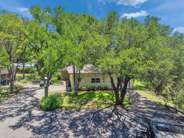 an empty room with closet and windows