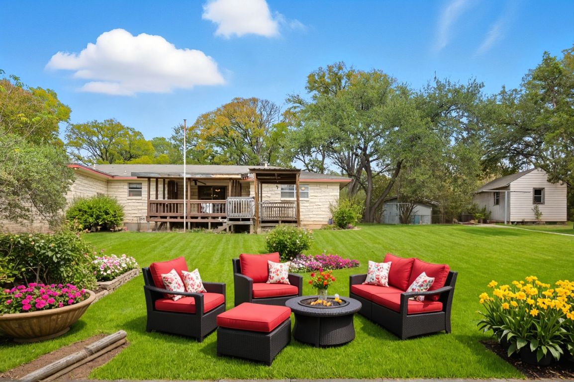508 Morris Drive Georgetown, TX 78628 - Photo 3 of 40 a view of a chair and table in the garden in the backyard