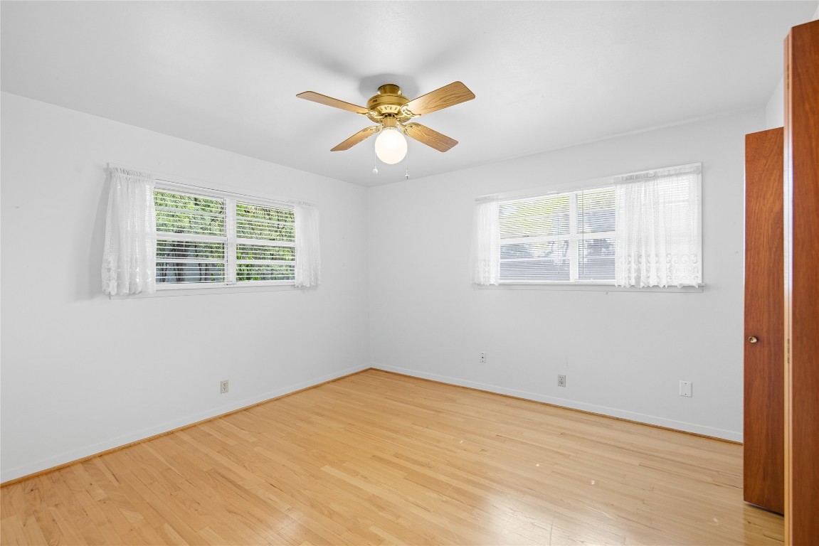 508 Morris Drive Georgetown, TX 78628 - Photo 33 of 40 Empty room with healthy amount of natural light, light wood-style floors, and ceiling fan