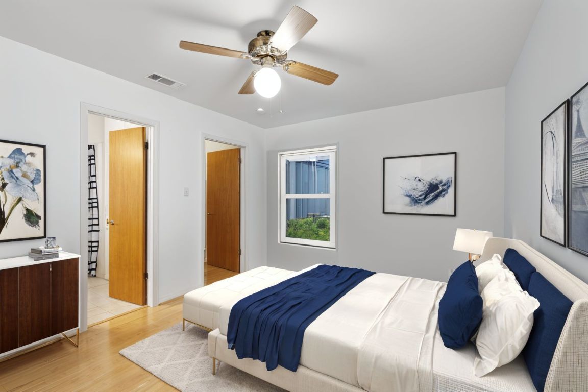 508 Morris Drive Georgetown, TX 78628 - Photo 9 of 40 ReImagine AI Photo. Bedroom with light wood finished floors and a ceiling fan