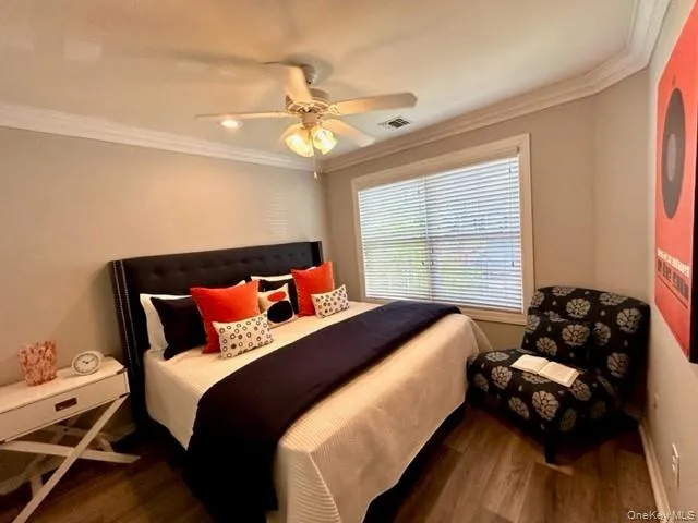 a bedroom with bed chair and window