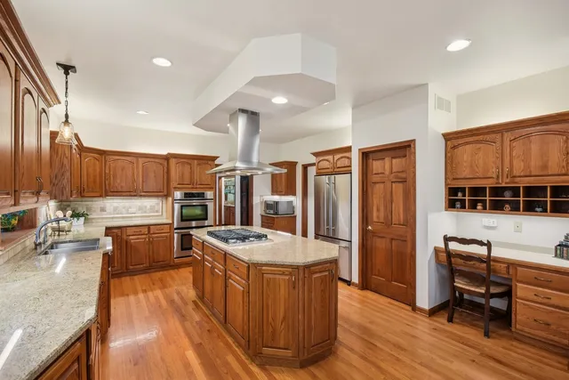a view of a storage & utility room with dryer and washer