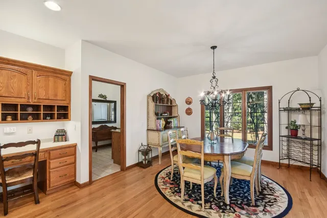 a bedroom with a bed mirror and window