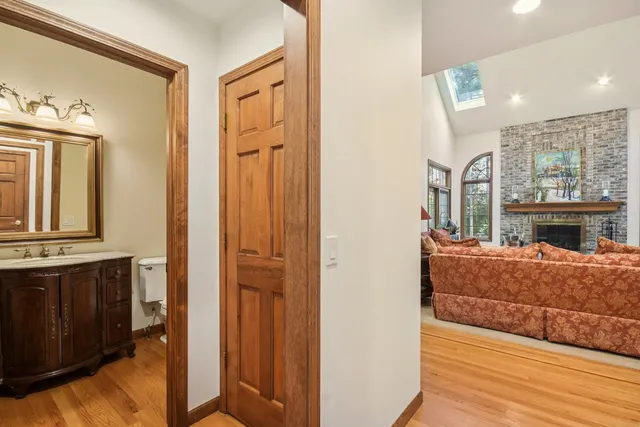 a bathroom with a tub sink and mirror