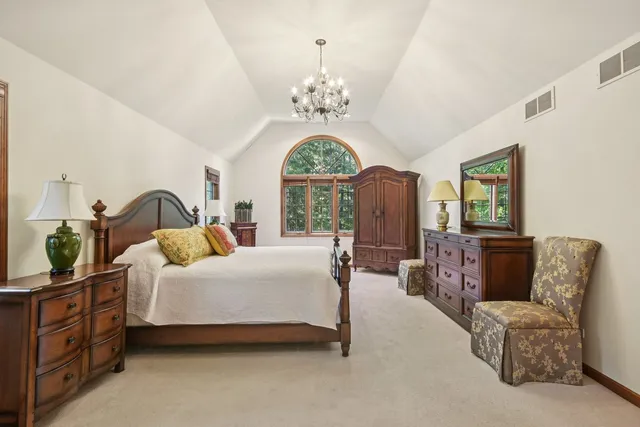 a view of a livingroom with workspace and a window