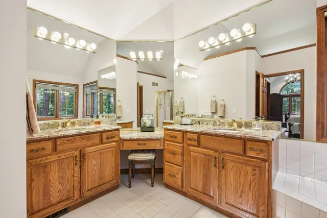 a view of a hallway with a large window and refrigerator