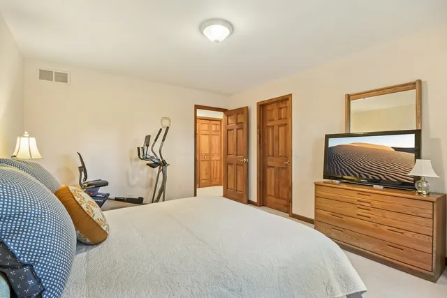 a view of a patio with table and chairs and potted plants