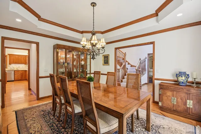 a living room with furniture fireplace and a large window