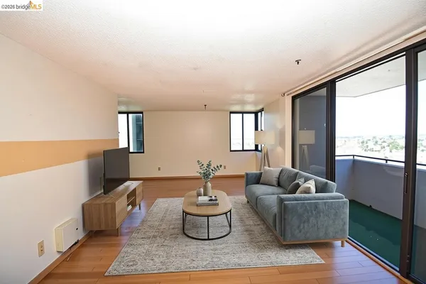 a living room with furniture and a large window