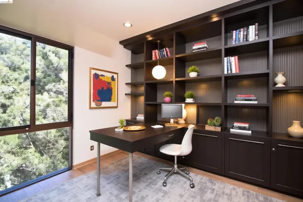 a table room with wooden floor and furniture