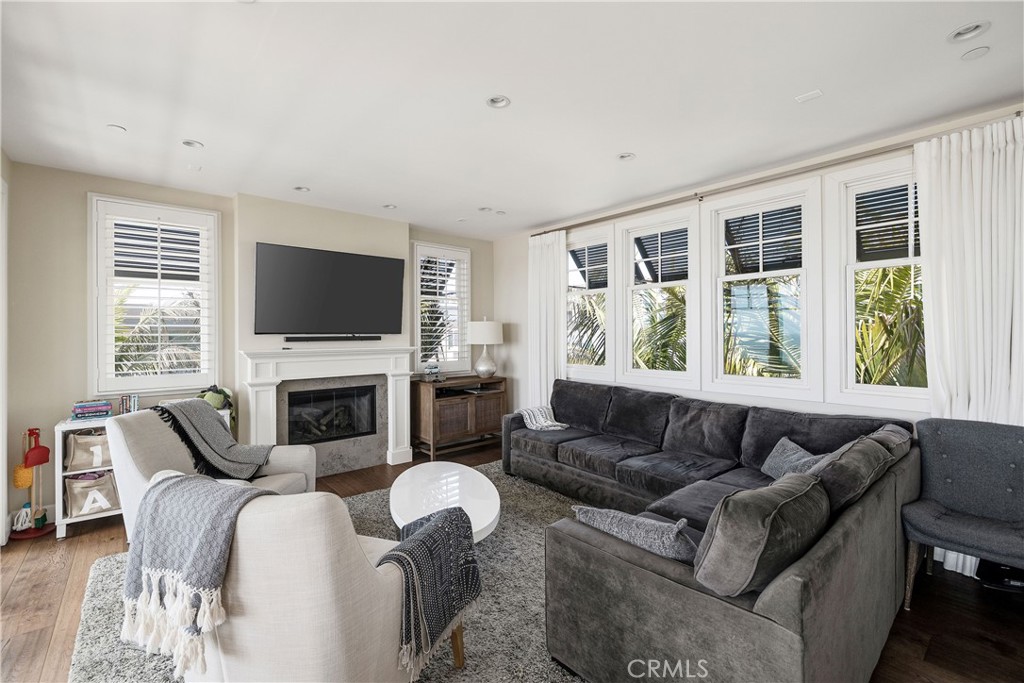 124 23rd Street Manhattan Beach, CA 90266 - Photo 12 of 50 a living room with furniture a flat screen tv and a fireplace