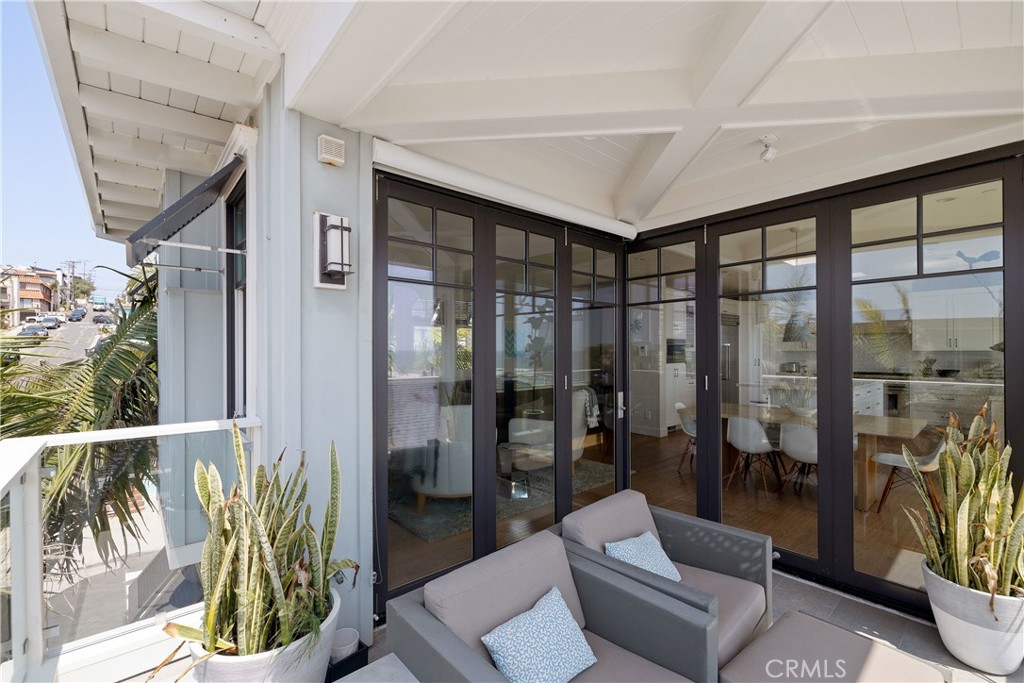 124 23rd Street Manhattan Beach, CA 90266 - Photo 21 of 50 a living room with furniture and a floor to ceiling window