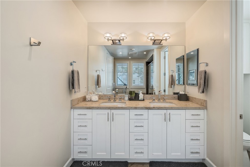 124 23rd Street Manhattan Beach, CA 90266 - Photo 37 of 50 a bathroom with a sink and a mirror