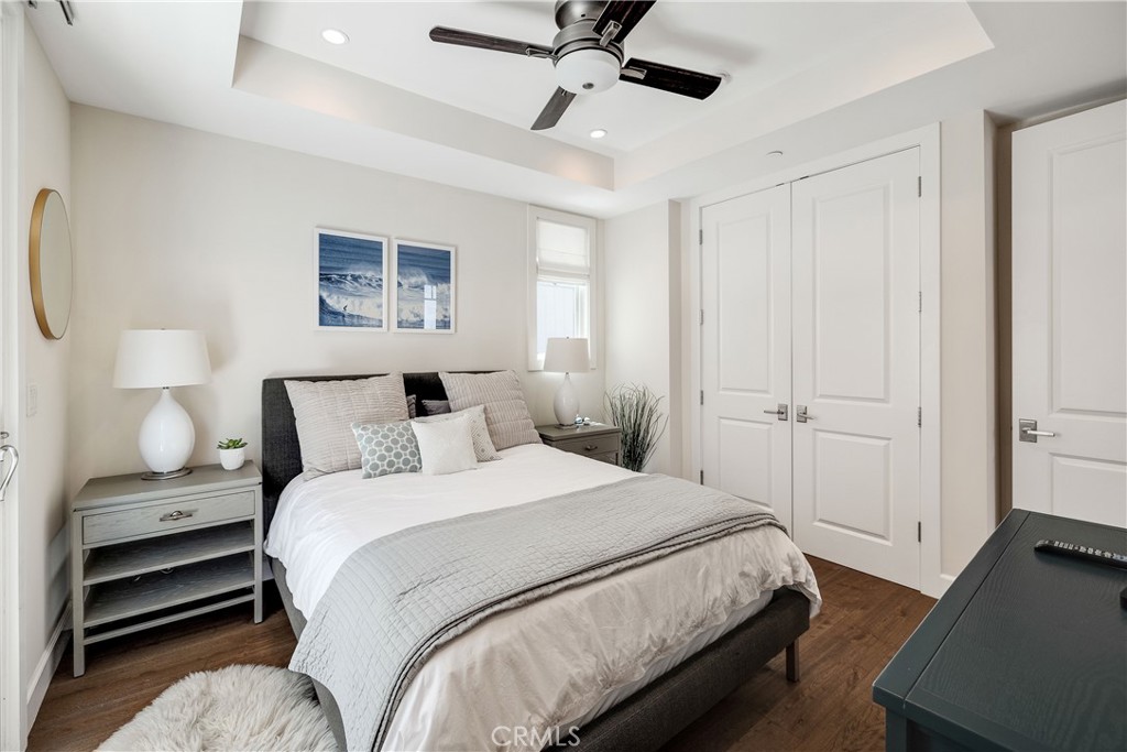 124 23rd Street Manhattan Beach, CA 90266 - Photo 46 of 50 a bedroom with a bed and a chandelier