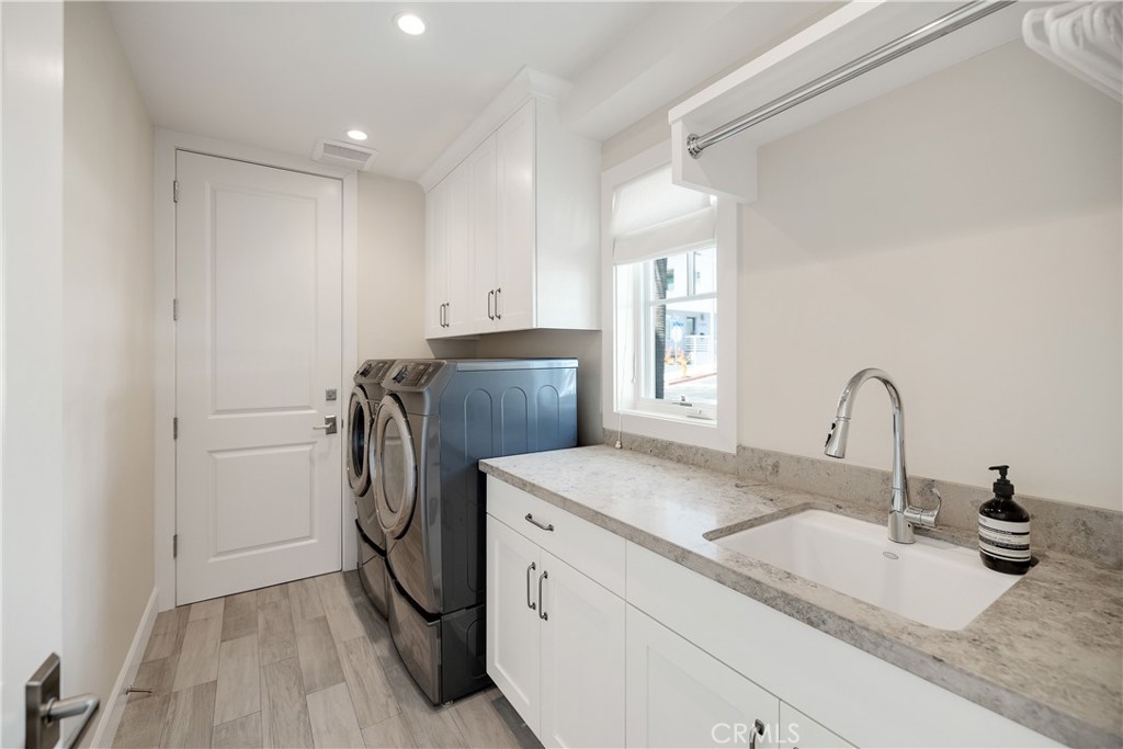 124 23rd Street Manhattan Beach, CA 90266 - Photo 50 of 50 a room with a sink a washer and dryer