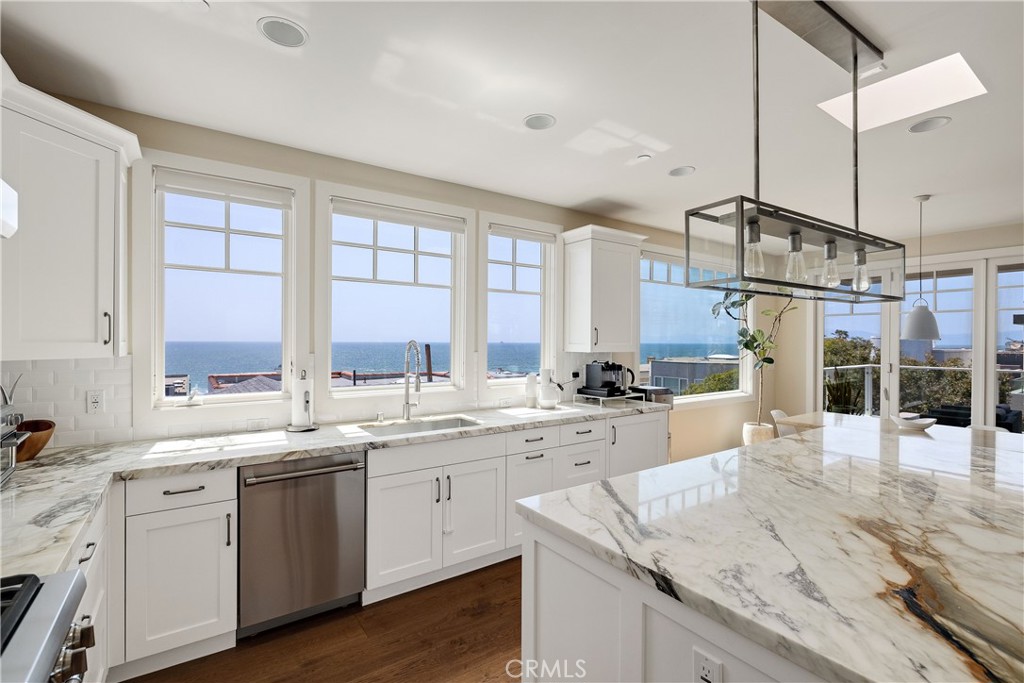124 23rd Street Manhattan Beach, CA 90266 - Photo 8 of 50 a kitchen with a sink cabinets and window