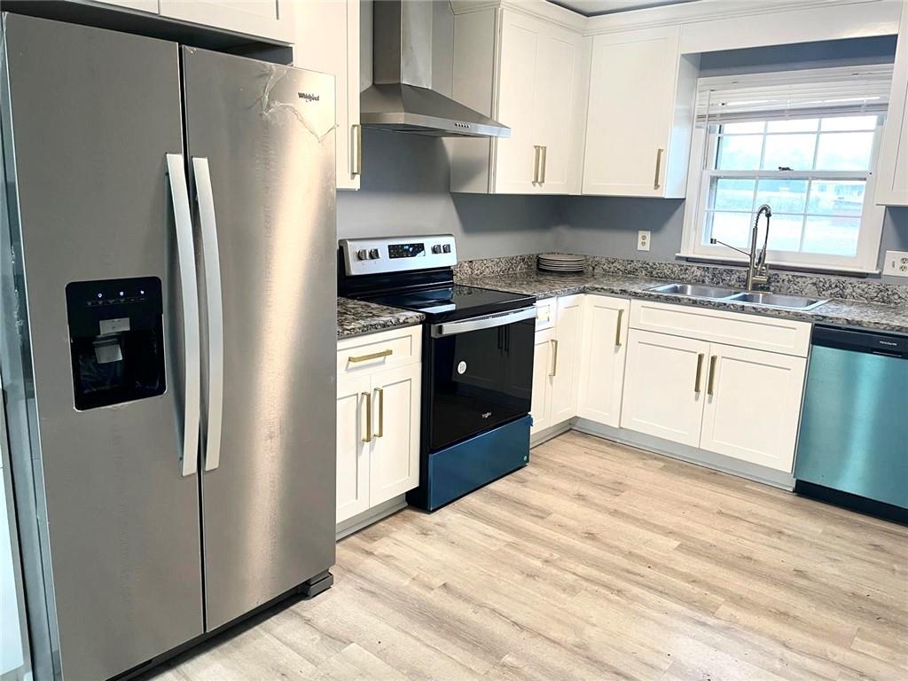 12266 Brown Bridge Road Covington, GA 30016 - Photo 5 of 12 a kitchen with stainless steel appliances granite countertop a refrigerator sink and stove