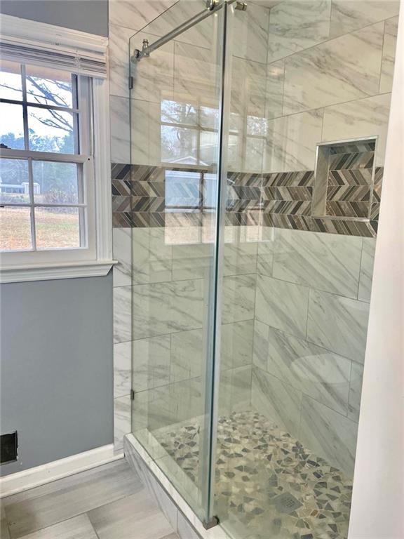 12266 Brown Bridge Road Covington, GA 30016 - Photo 8 of 12 a bathroom with a shower