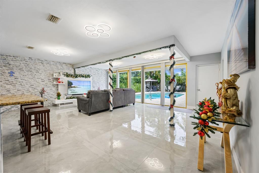 1336 Funston Street Hollywood, FL 33019 - Photo 12 of 51 a lobby with furniture and floor to ceiling window
