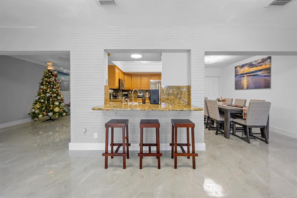 1336 Funston Street Hollywood, FL 33019 - Photo 19 of 51 a dining room with furniture and window