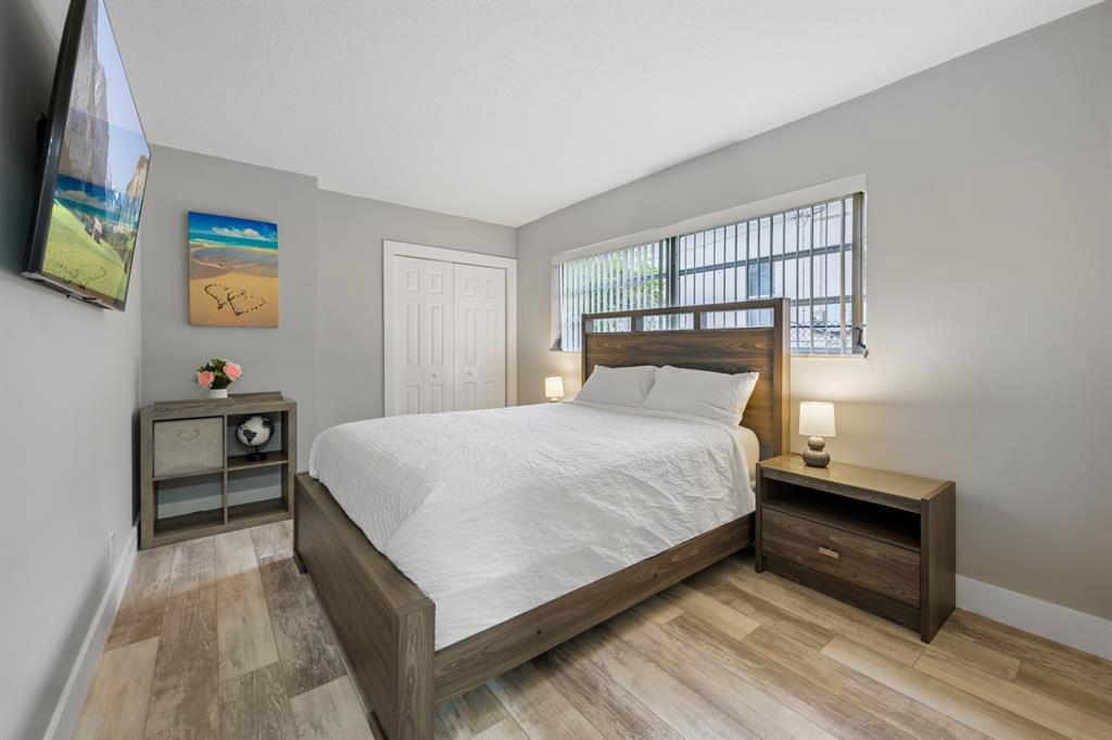 1336 Funston Street Hollywood, FL 33019 - Photo 27 of 51 a bedroom with a bed and a window