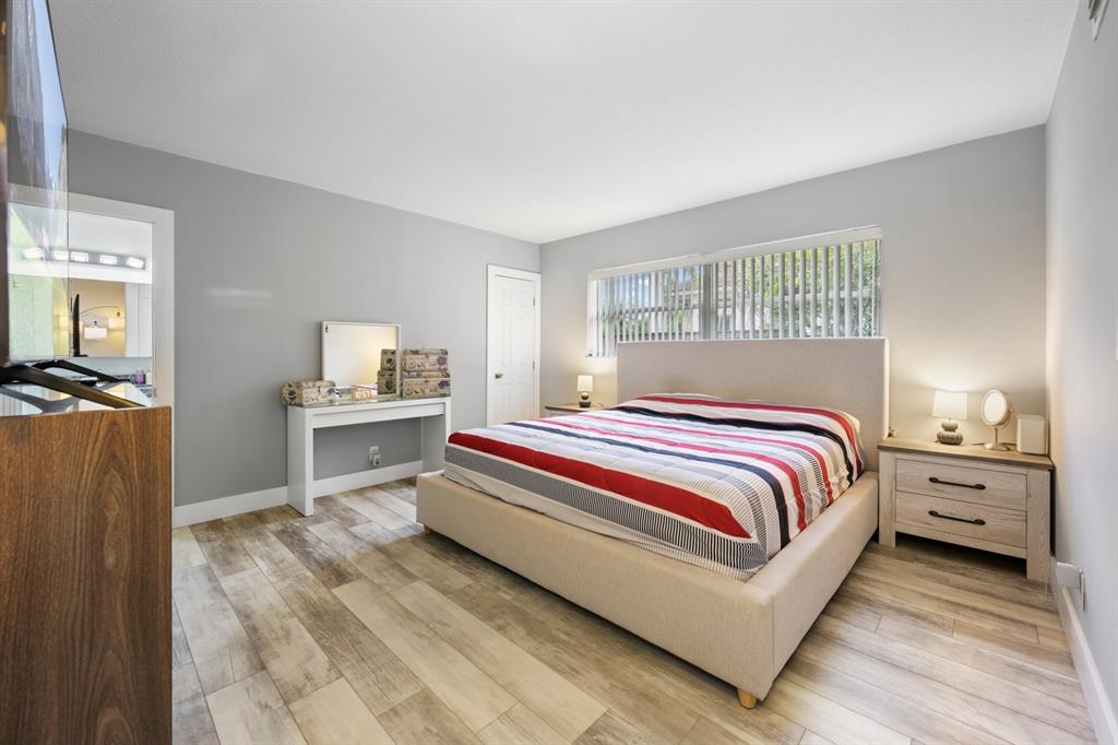 1336 Funston Street Hollywood, FL 33019 - Photo 30 of 51 a bedroom with a bed and a view of kitchen