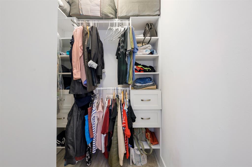 1336 Funston Street Hollywood, FL 33019 - Photo 32 of 51 a view of walk in closet with clothes and shoes