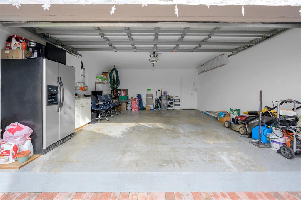 1336 Funston Street Hollywood, FL 33019 - Photo 35 of 51 a view of a garage with a bike and storage