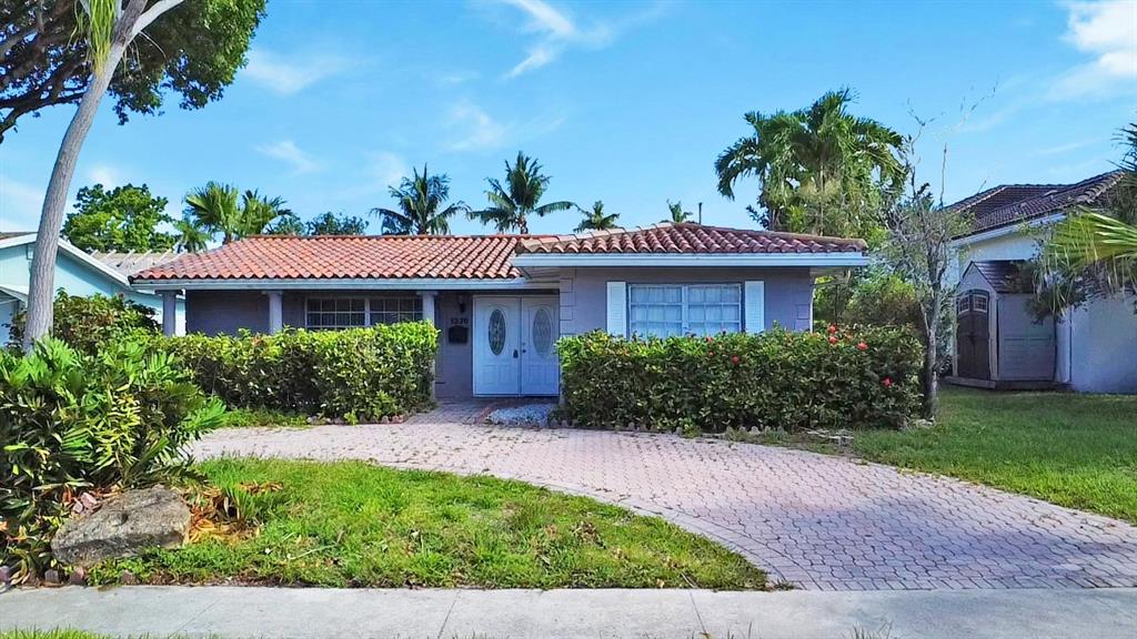 1336 Funston Street Hollywood, FL 33019 - Photo 48 of 51 a front view of a house with a yard