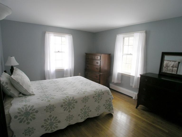 14 Knox Road Dennis Port, MA 02639 - Photo 11 of 14 a bedroom with a bed and a window