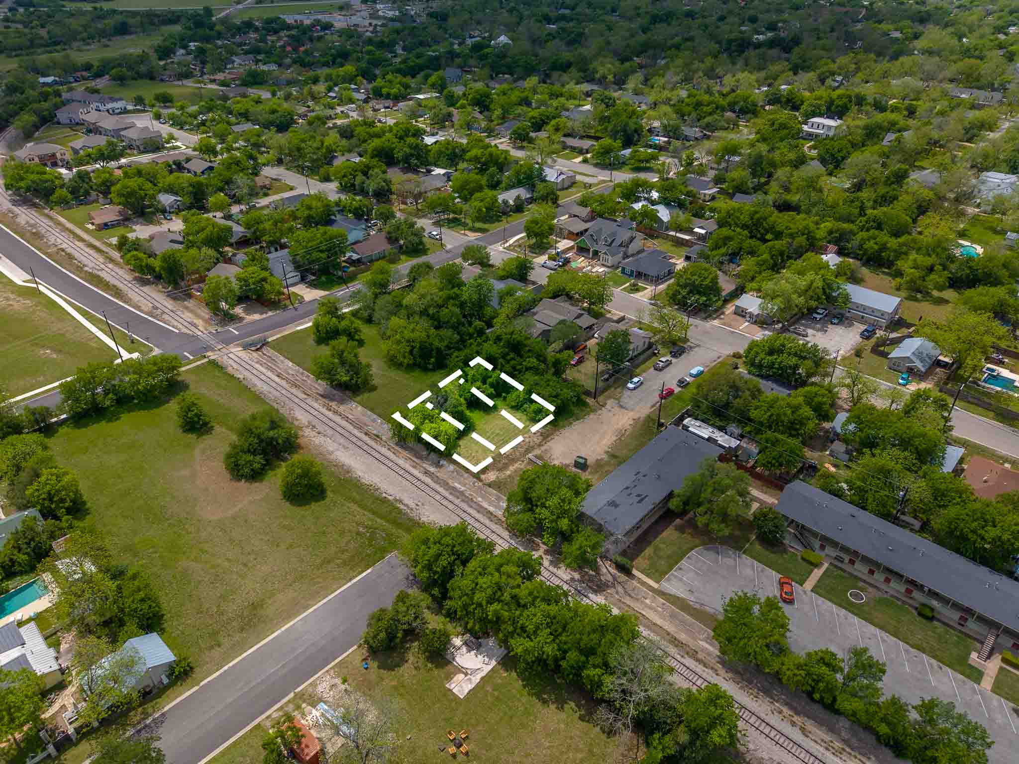901 East 14th Street Georgetown, TX 78626 - Photo 4 of 6 an aerial view of residential houses with outdoor space