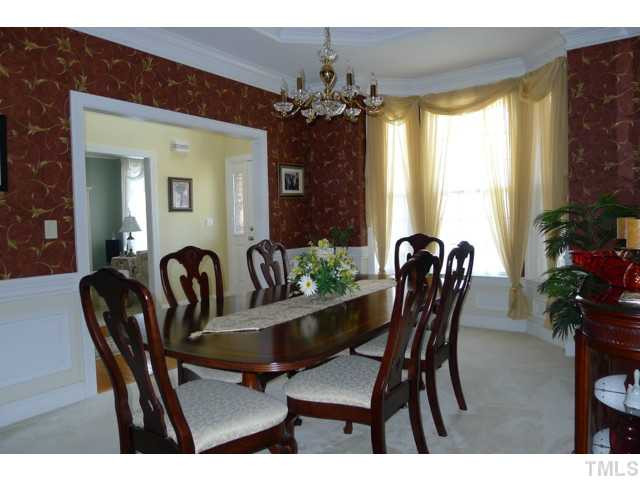 316 Powers Ferry Road Cary, NC 27519 - Photo 10 of 25 The formal dining room features a trey ceiling, a bay window and crown, chair rail and picture molding. Dining Room