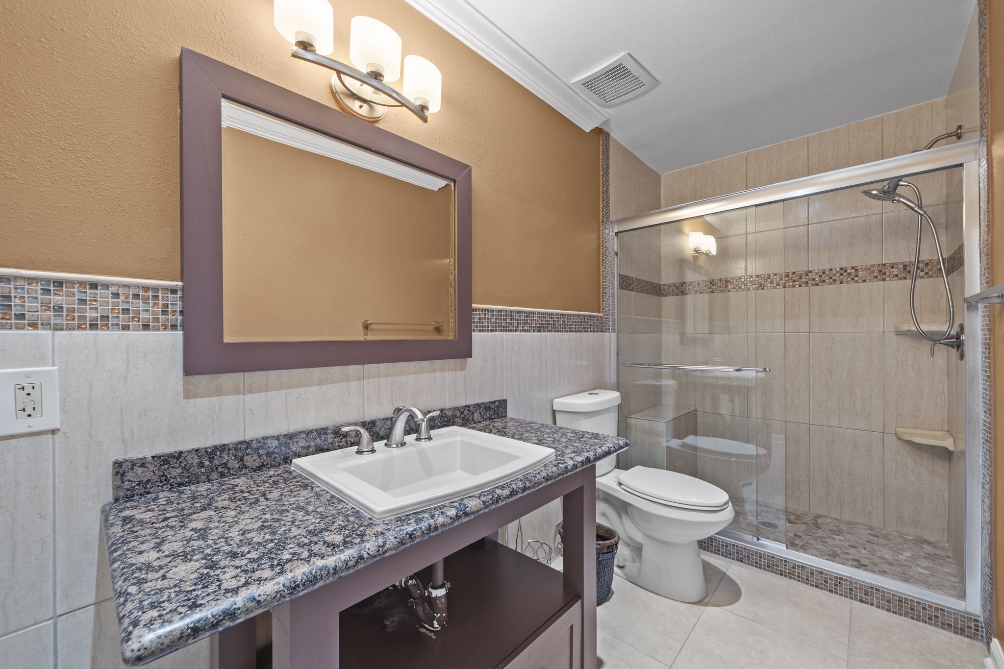 5801 Lumberdale Road, Unit 132 Houston, TX 77092 - Photo 15 of 33 Beautifully renovated primary bathroom with oversized walk-in shower.