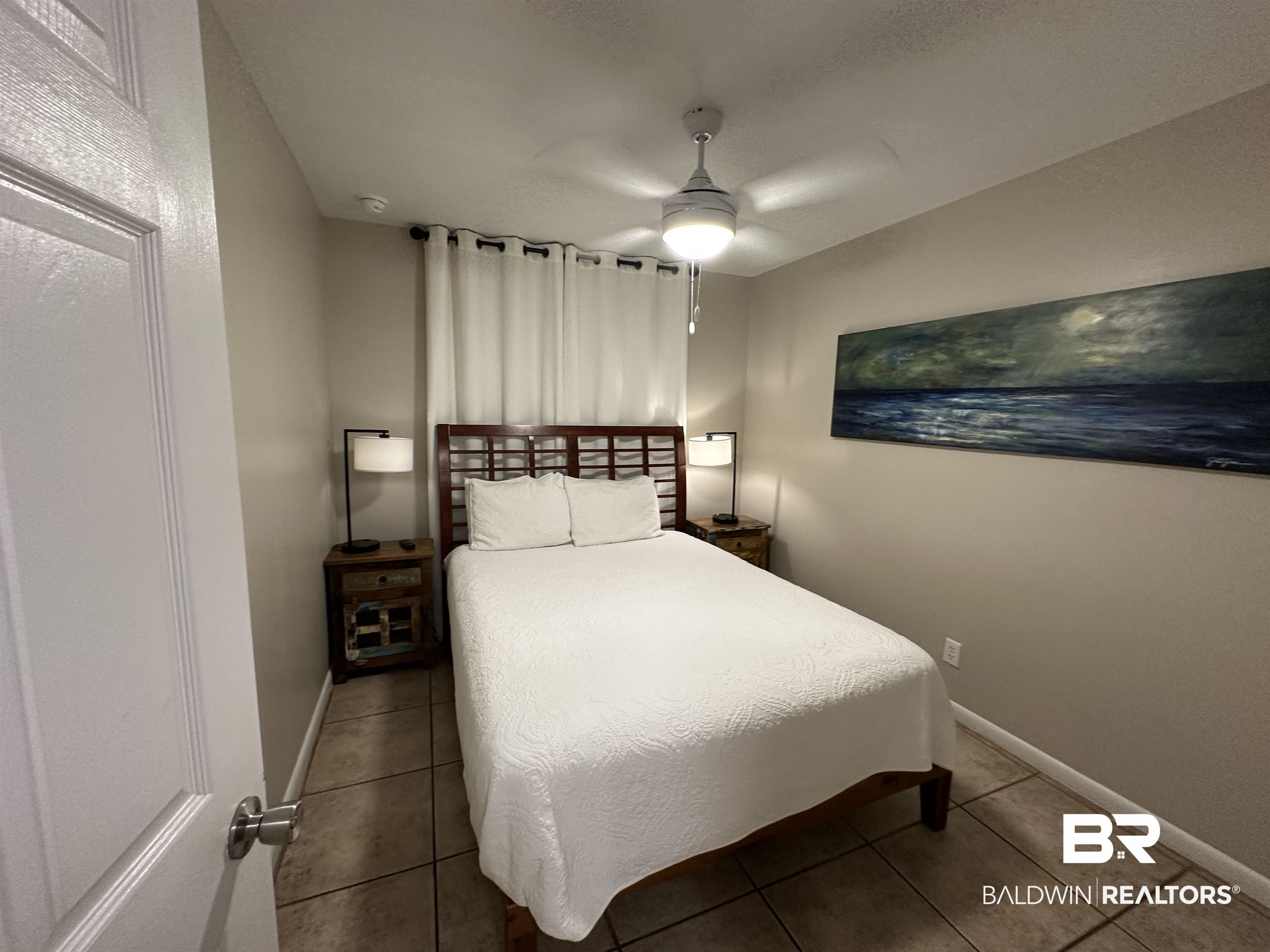 400 Plantation Road, Unit 2202 Gulf Shores, AL 36542 - Photo 21 of 26 Bedroom with ceiling fan and tile patterned flooring